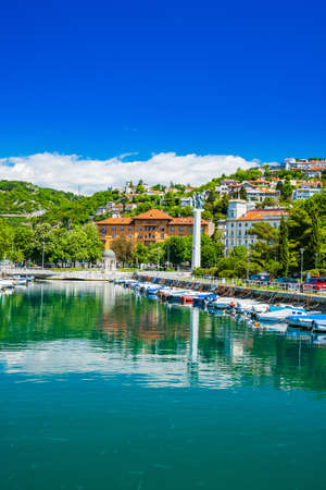 Croatia, city of Rijeka, skyline view from Delta and Rjecina river over the boats in front, colorful old buildings, monuments and Trsat on the hill in backgroundのeditorial素材