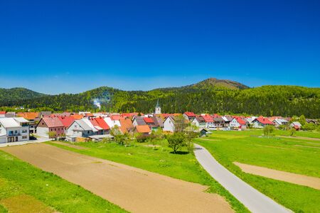 Croatia, town of Delnice, Gorski kotar, panoramic view of town center from drone in spring, mountain landscape in backgroundの写真素材