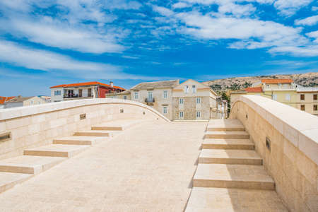 Old town of Pag on Adriatic sea, Dalmatia, Croatia, marina and old stone bridge. Popular tourist destination.の写真素材