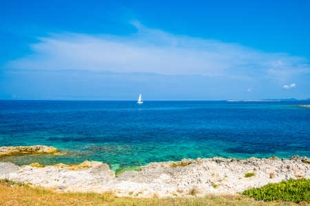 Beautiful seascape on Adriatic sea in Croatia, Dugi otok island, sailing boat on sea in bay on Veli Ratの写真素材