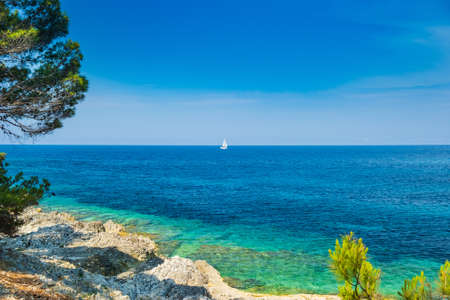 Beautiful seascape on Adriatic sea in Croatia, Dugi otok island, sailing boat on sea in bay on Veli Ratの写真素材