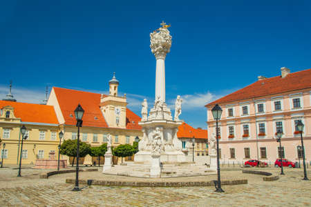Holy trinity square, pillars with statues in Tvrdja, old historic town of Osijek, Croatiaの写真素材