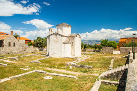 Croatia, romanesque medieval church of Holy Cross and archaeological site in town of Nin in Dalmatia, popular tourist destinationの写真素材