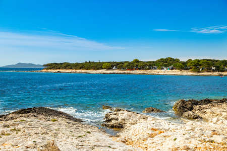 Beautiful blue bay on Adriatic sea in Croatia, Dugi Otok island, camping resort in Veli Rat pine forestの写真素材