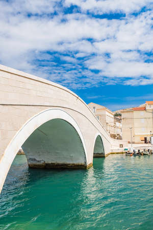 Old town of Pag on Adriatic sea, Dalmatia, Croatia. Beautiful old stone bridge.の写真素材
