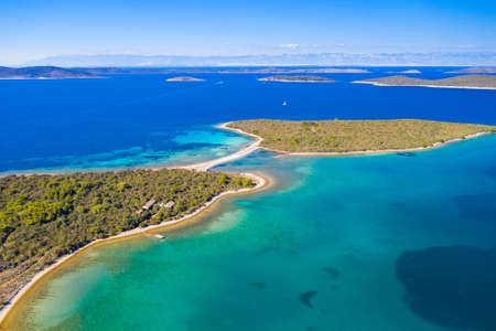 Amazing exotic islands with natural bridge in turquoise sea on the island of Dugi Otok in Croatia, drone aerial, Adriatic sea paradiseの写真素材