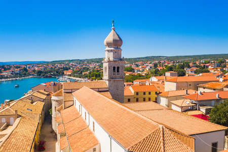 Panoramic view of the old town of Krk in Croatia, cathedral tower and seascape in backgroundの写真素材