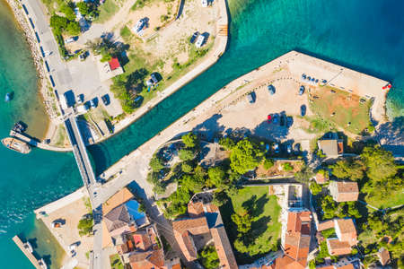 Beautiful old historic town of Osor, marina and bridge connecting islands Cres and Losinj, Croatia, aerial view from droneの写真素材