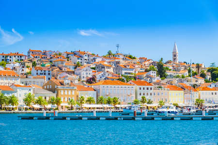 Town of Mali Losinj on the island of Losinj, Croatia, seafront and city skyline with old cathedral towerの写真素材