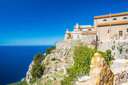 Amazing old town of Lubenice on the high cliff, Cres island in Croatia, Adriatic sea in backgroundの写真素材