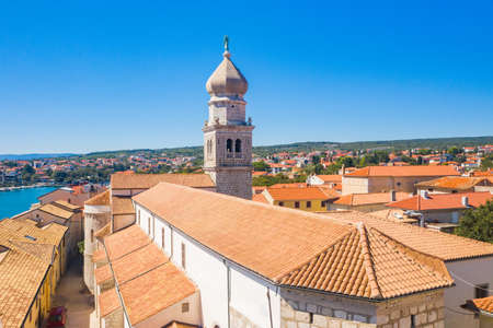 Panoramic view of the old town of Krk in Croatia, cathedral tower and seascape in backgroundの写真素材