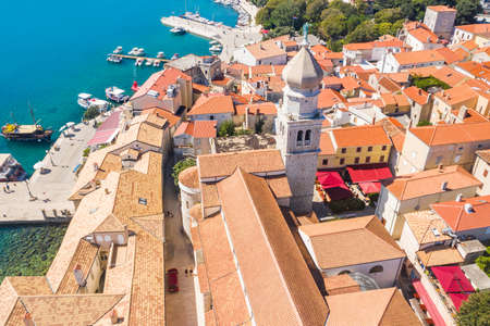 Panoramic view of the old town of Krk in Croatia, cathedral tower and seascape in backgroundの写真素材