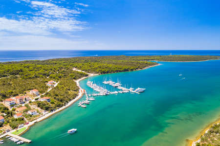 Marina and tpwn of Veli Rat on Dugi Otok island on Adriatic sea in Croatia, aerial view from droneの写真素材