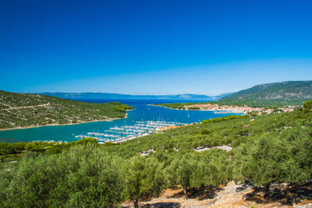 Panoramic view of Adriatic seascape, blue bay and town of Cres on the island of Cres in Croatiaの写真素材