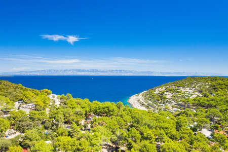 Drone aerial view of the island of Losinj, pine woods and touristic restorts on beautiful Adriatic coastline. Kvarner bay, Croatia, Europe.の写真素材