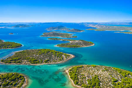 Wonderful coastline seascape, small Mediterranean stone islands in Murter archipelago, aerial view of turquoise bays from drone, Dalmatia, Croatiaの写真素材