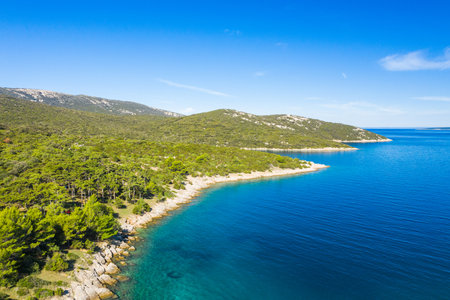 Amazing seascape on Adriatic sea, long shore of the island of Losinj in Croatia, aerial view from droneの写真素材
