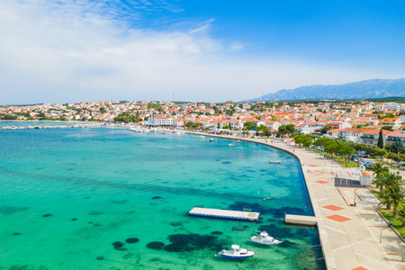 Beautiful Adriatic town of Novalja on the island of Pag in Croatia, aerial view from droneの写真素材
