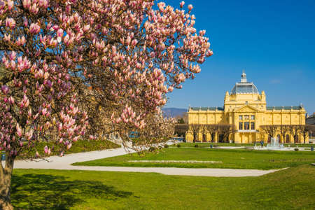 Colorful magnolia blossom and art pavilion in spring in Zagreb, Croatiaのeditorial素材