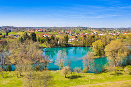 Mreznica river in Croatia from air, drone view of Belavici village in springの写真素材