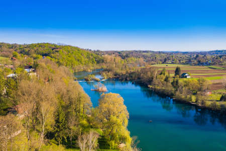 Mreznica river in Croatia from air, drone view of Belavici village in springの写真素材