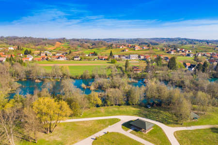 Beautiful countryside landscape, Mreznica river and Belavici village from air, Croatiaの写真素材