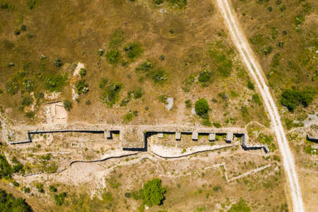Stone ruins of ancient town of Asseria in Dalmatia, Croatia. Aerial view.の写真素材