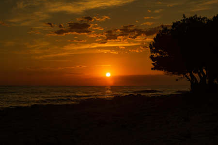 Sunset over Adriatic sea horizon, colorful red sky, island of Dugi Otok, Croatiaの写真素材