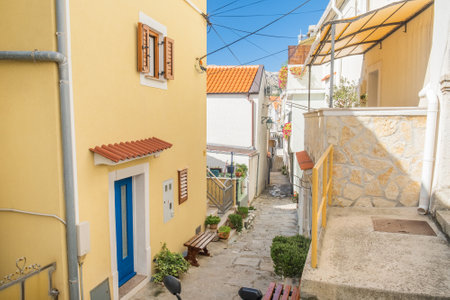 Old street in in historic coastal town of Baska on Krk island in Croatiaの写真素材
