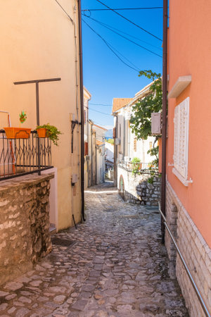 Old street in in historic town of Omisalj on Krk island in Croatiaの写真素材