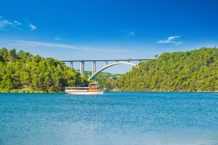 Arched bridge across Krka river near town of Sibenik in Croatiaの写真素材