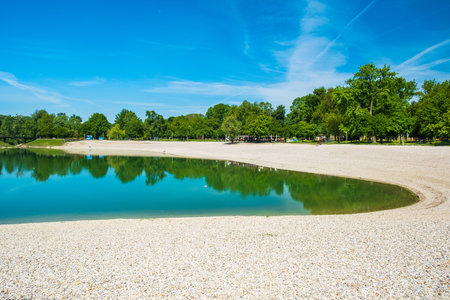 Lake in the park. Beautiful summer landscape with lake and blue skyの写真素材