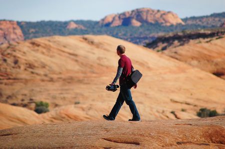 Man walking on a rock in Moab.の写真素材
