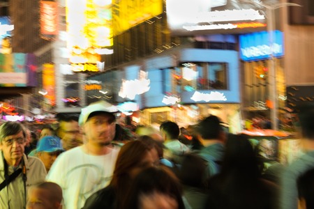 People walking during the night in the famous Time Square in Manhattanのeditorial素材