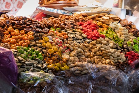 Bees over a street food stand of sweet delights in Marrakesh, Moroccoの写真素材