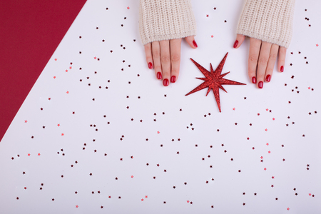 Red festive female manicure. Flat lay style.の写真素材