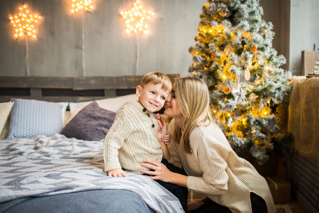 Mother and baby boy on New Year background.の写真素材