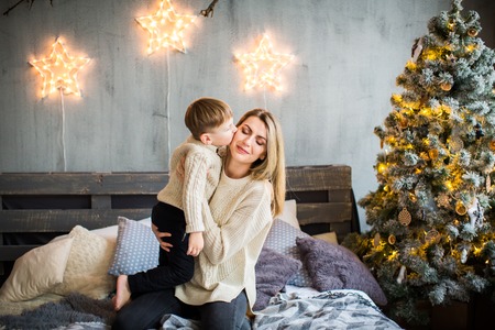 Mother and baby boy on New Year background.の写真素材
