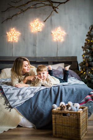 Mother and baby boy on New Year background.の写真素材
