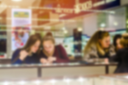 girls choose the goods on the counter, the blurred background, the concept of purchase, the concept of fashion, style, peopleの写真素材