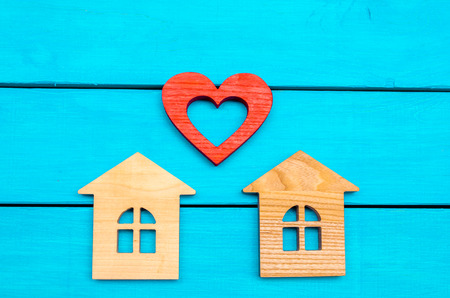 wooden houses  and heart on a blue backgroundの写真素材