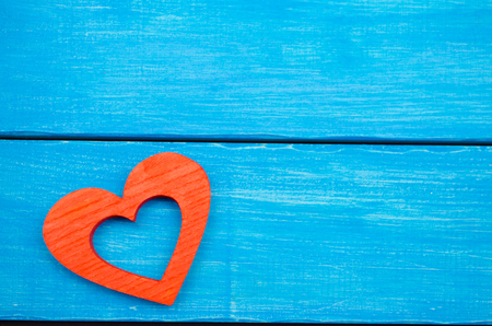 red wooden heart on a blue background, Valentine's Day. concept of love



の写真素材
