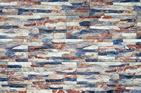 Close-up of stone wall pattern natural surface. Modern and creative interior and exteriorの写真素材