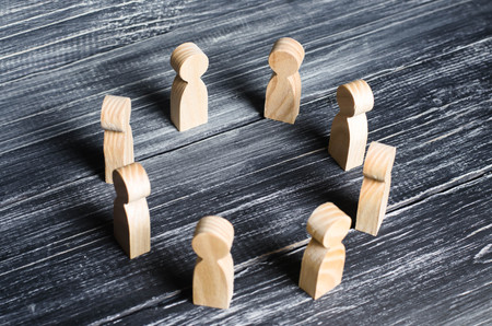 People stand in a circle and discuss. Concept business ideas, cooperation, teamwork, training and training. Solving problems and tasks. Businessmen gathered in a circle for a meeting.の写真素材