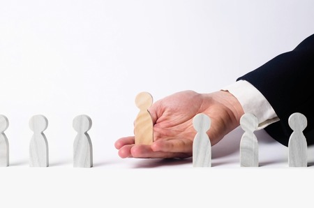 Businessman in search of new employees and specialists. The concept of personnel selection and management within the team. Dismissal and hiring people to work. Human Resource Management.の写真素材