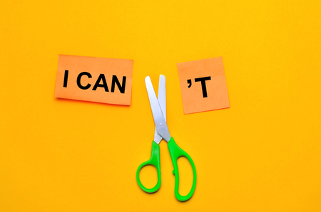 I can self motivation - cutting the letter t of the written word I can't so it says I can, goal achievement, potential, overcomingの写真素材