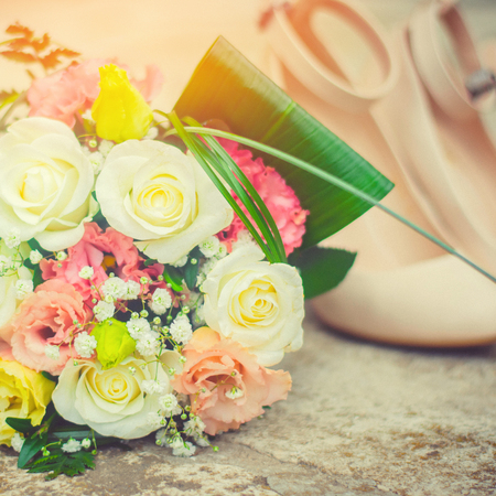 bridal bouquet and shoes, beautiful wedding decoration

の写真素材