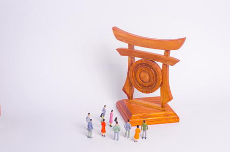 People are standing near the sights. A crowd of tourists looking at the Chinese Japanese gates. The concept of travel and tourism, outdoor activities, cultural exchange and the of other civilizationsの写真素材