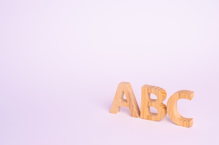 Red apple and letters ABC on a white background. The concept of primary education. school, college, university, educational institution. Alphabetの写真素材