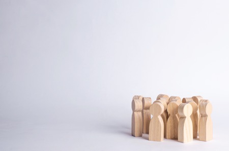 A crowd of people on a white background. People stand in the crowd and discuss. Cooperation and work together. Follows the leader, herd instinct. A company of friendsの写真素材